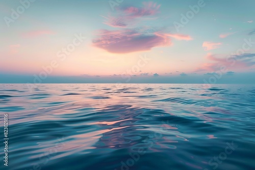 Serene sunset over a calm ocean, pastel clouds in the sky reflecting in the tranquil water, creating a peaceful and relaxing seascape.