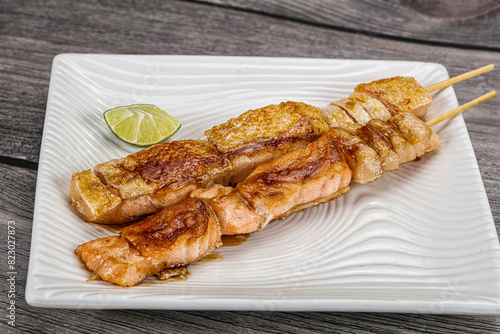 Grilled salmon skewer with sauce