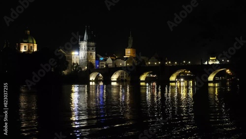 Prague Old Town: Night view of the Charles Bridge and Vltava River at night, in the city of Prague. photo