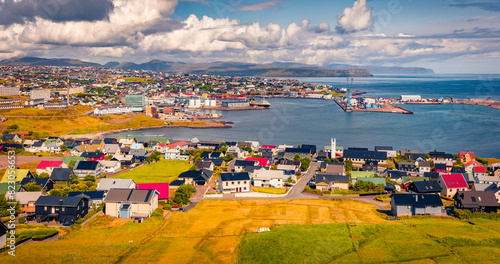 Exciting summer sityscape of Torshavn town. Sunny morning scene of Streymoy island, Faroe, Denmark, Europe. Traveling concept background. photo