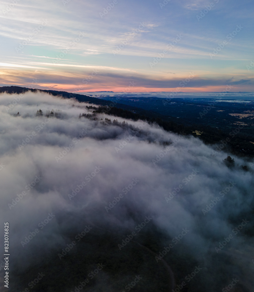 Fototapeta premium Sea of clouds around mountain peaks