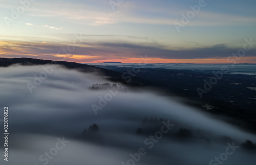 Long exposure of clouds around mountain peaks