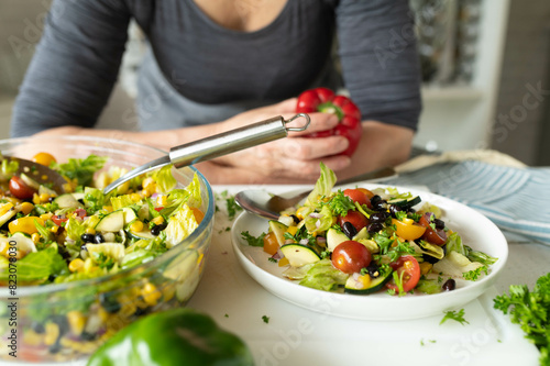 Wallpaper Mural Woman with a fresh prepared healthy mexican salad in the kitchen Torontodigital.ca