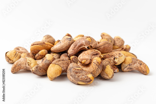 Shelled cashew nuts on white background