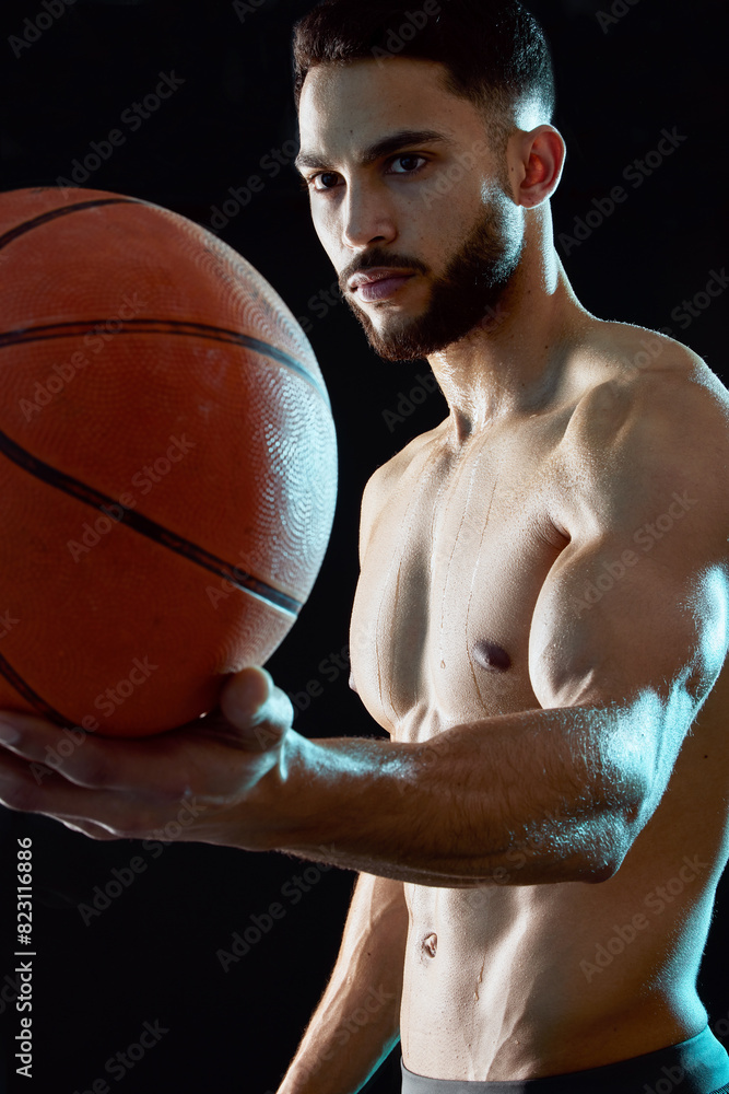 Man, fitness and sport with basketball for game, match or challenge in studio on a black background. Active male person, athlete or player with ball for exercise, training or health and wellness Man, fitness and sport with basketball for game, match or challenge in studio on a black background. Active male person, athlete or player with ball for exercise, training or health and wellness