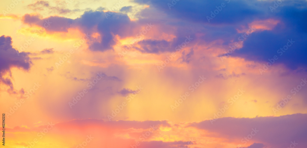 Fototapeta premium Colorful cloudy sky at sunset. Sky texture. Abstract nature background. Horizontal banner
