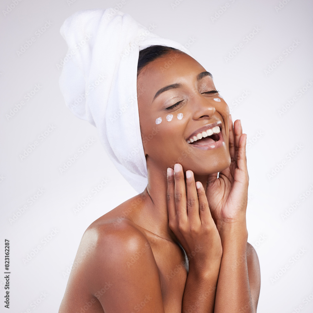 © peopleimages.com - Woman, cream and happy for skincare with routine in studio on white background and satisfied with results. Natural, beauty and moisturizer with smile for transformation, facial and skin treatment