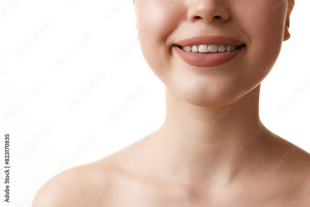 Close up of beautiful wide female smile against white studio background. Oral care dentistry, stomatology. Concept of hygiene treatments, dental health, wellness. Ad