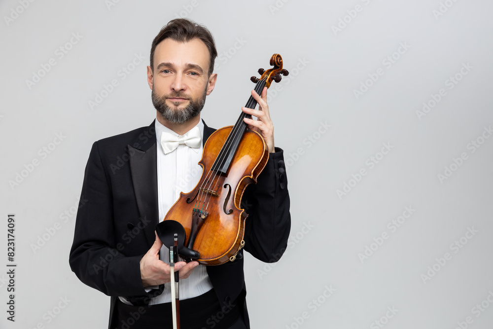 Bearded man passionate violin player at classical music performance Bearded man passionate violin player at classical music performance