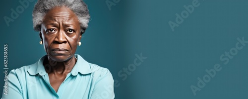 Cyan background sad black american independant powerful Woman realistic person portrait of older mid aged person beautiful bad mood expression Isolated on Background racism photo