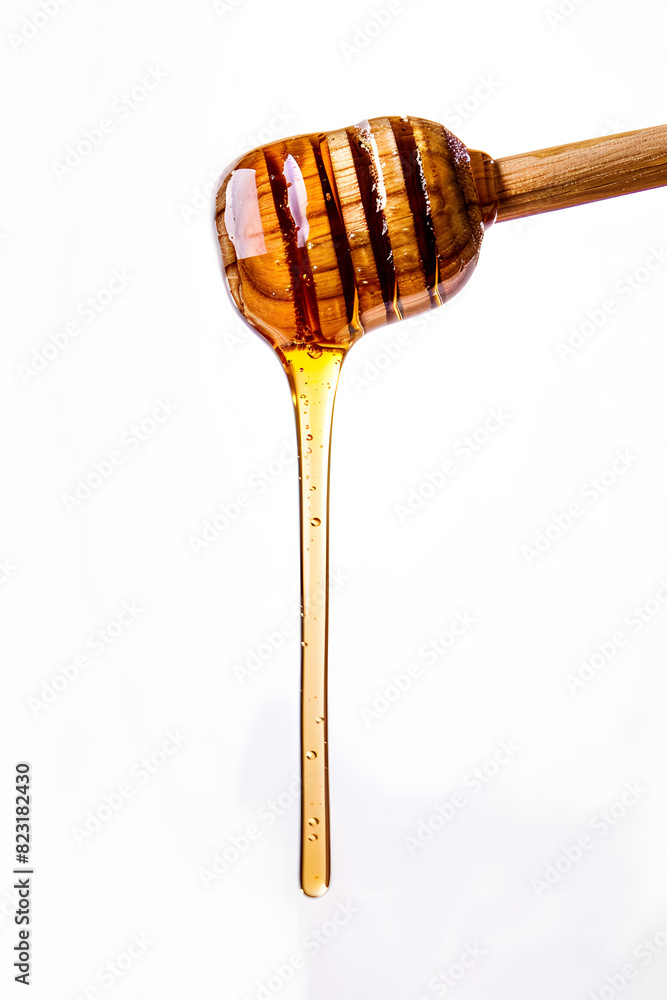 Wooden dipper stick dripping with honey top view isolated on white background Wooden dipper stick dripping with honey top view isolated on white background
