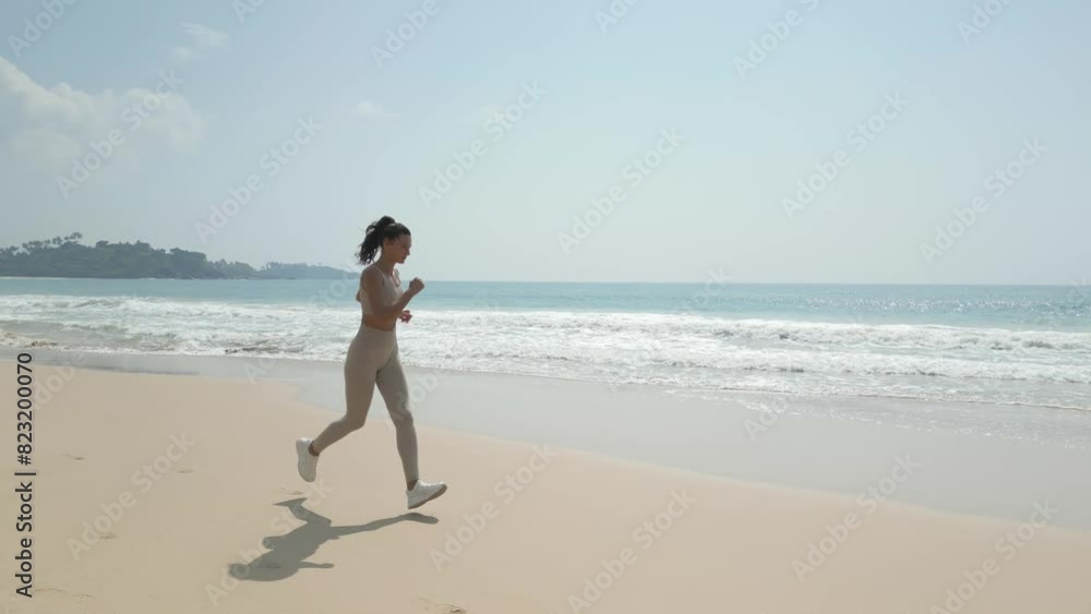 Aerial Tracking Drone Shot of Runner Jogger Woman During Run on Beach Aerial Tracking Drone Shot of Runner Jogger Woman During Run on Beach