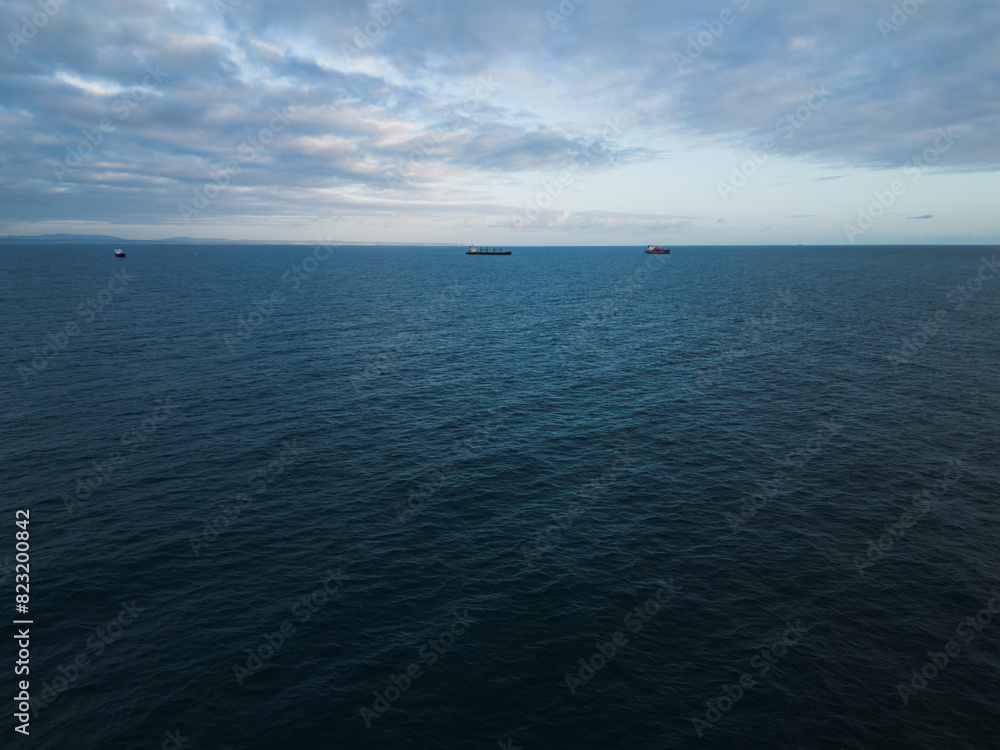 Maritime logistics, cargo ships and tankers in the Atlantic Ocean, photo from a drone in Portugal. Maritime logistics, cargo ships and tankers in the Atlantic Ocean, photo from a drone in Portugal.