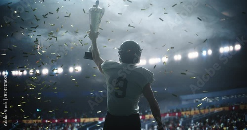 American Football Player Celebrating Victory, Holding Trophy High in Stadium with Falling Glittering Confetti and Cheers from the Sport Crowd. Footballer Full of Joy and Triumph After Championship Win
