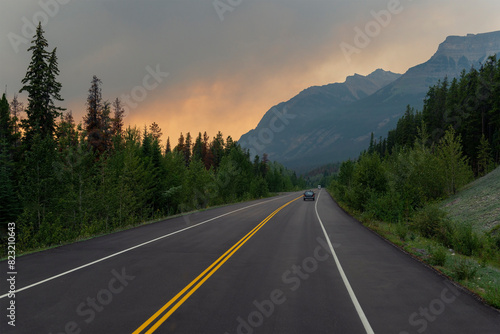 Dramatic landscape with smoke clouds along highway in British Columbia during wildfires, Canada. photo