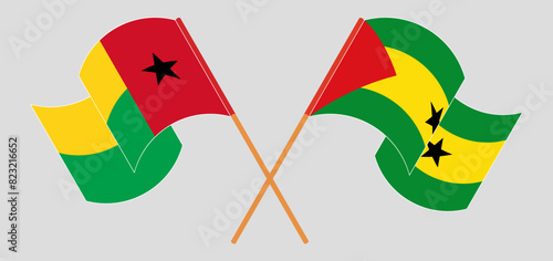Crossed and waving flags of Guinea-Bissau and Sao Tome and Principe