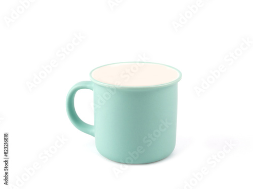 Empty green mint color mug for coffee or tea isolated on white background. Use for home or restaurant, food design. Concept kitchen utensils and tableware..