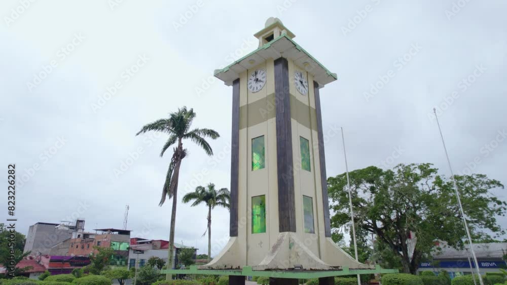 Explore the majestic Clock Rotunda, a legacy of the Japanese colony in Puerto Maldonado, with this left-to-right aerial shot. A unique view focused on the impressive clock Explore the majestic Clock Rotunda, a legacy of the Japanese colony in Puerto Maldonado, with this left-to-right aerial shot. A unique view focused on the impressive clock