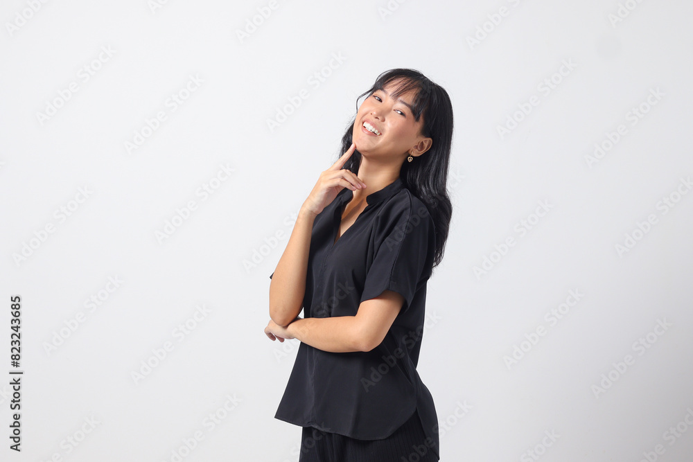 Portrait of attractive Asian woman in casual shirt feeling confident, posing with professional hand gesture. Isolated on white background Portrait of attractive Asian woman in casual shirt feeling confident, posing with professional hand gesture. Isolated on white background