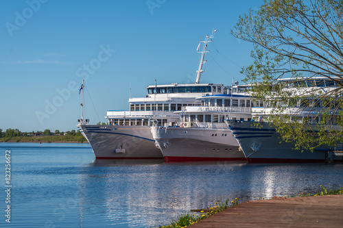 Cruise ships stand at the pier in the ancient Russian city of Uglich. photo