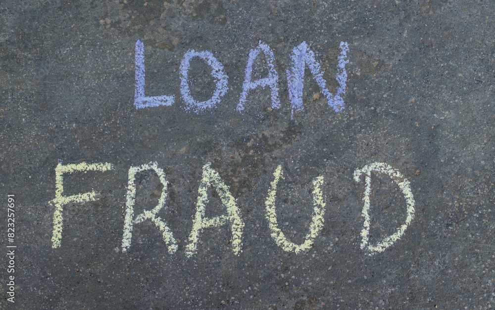 Fototapeta premium Loan Fraud Phrase Written on Blackboard with Chalk