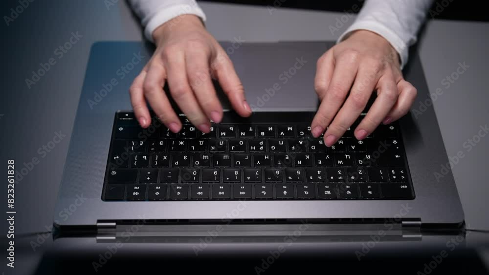 Top view of unrecognizable freelancer developer typing program code on laptop keyboard in dark coworking. Closeup hands of businesswoman working in home office. Copywriter writing text on keyboard. Top view of unrecognizable freelancer developer typing program code on laptop keyboard in dark coworking. Closeup hands of businesswoman working in home office. Copywriter writing text on keyboard.