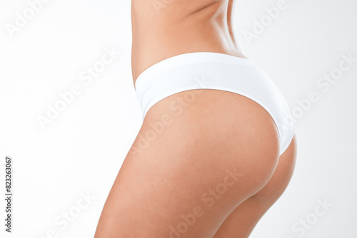 Underwear, butt and woman with skincare in studio for beauty, cellulite and wellness with dermatology treatment. Person, healthy and liposuction with spa care of natural body on white background