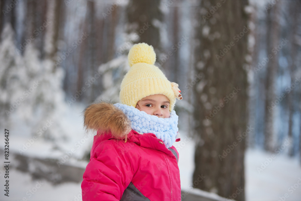 Obraz premium Little Girl in Pink Jacket and Yellow Hat