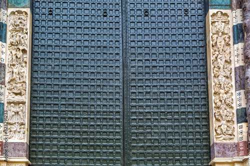 Details at facade of Genoa Cathedral or Metropolitan Cathedral of Saint Lawrence in Genoa, Italy.