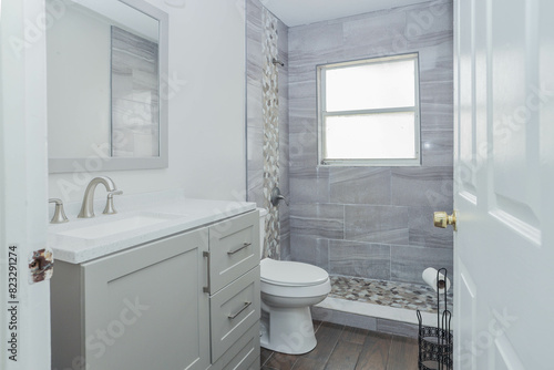 Wallpaper Mural White and gray bathroom with a sink, mirror, and cabinets Torontodigital.ca