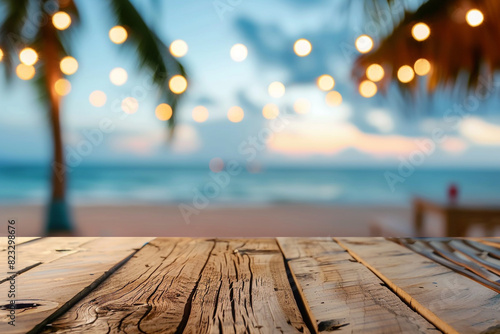 Wooden table and blur beach cafes background with bokeh lights High quality photo 