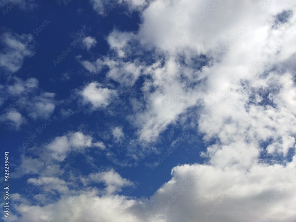 Beautiful blue sky, flying white clouds background Beautiful blue sky, flying white clouds background