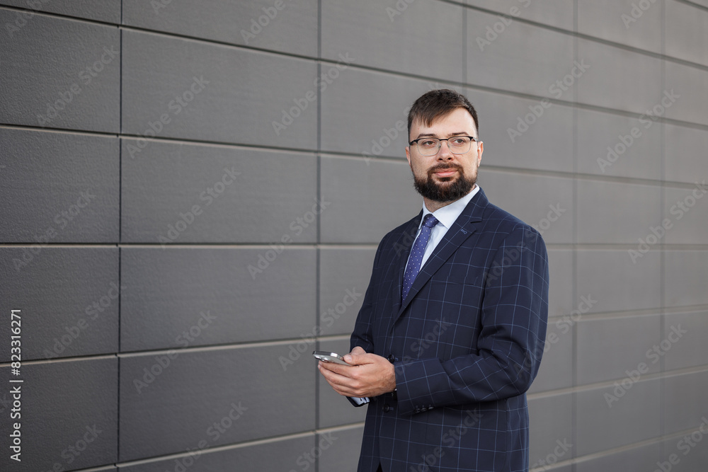 Millennial 30-35 years old man formal suit stands street. Unemployed Caucasian man shows empty poster. Copy space. Mockup. Promotional or template. Concept: unemployment. Poster for any text Millennial 30-35 years old man formal suit stands street. Unemployed Caucasian man shows empty poster. Copy space. Mockup. Promotional or template. Concept: unemployment. Poster for any text