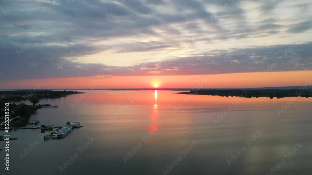 Calm lake during the sunrise captured by drone. Calm lake during the sunrise captured by drone.
