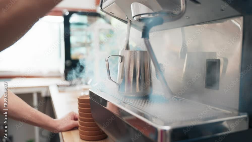 Senior Asian man barista is using a coffee maker. Bakery cafe and coffee shop small business owner concept Senior Asian man barista is using a coffee maker. Bakery cafe and coffee shop small business owner concept