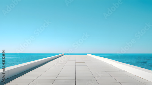 A minimalist white pier stretching out towards the blue sea  meeting the horizon. The expansive view and clear sky convey a sense of tranquility and endless possibility.