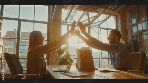5 business people doing high five at office, hands together concept of success and freedom working from home with papers on desk in modern loft interior