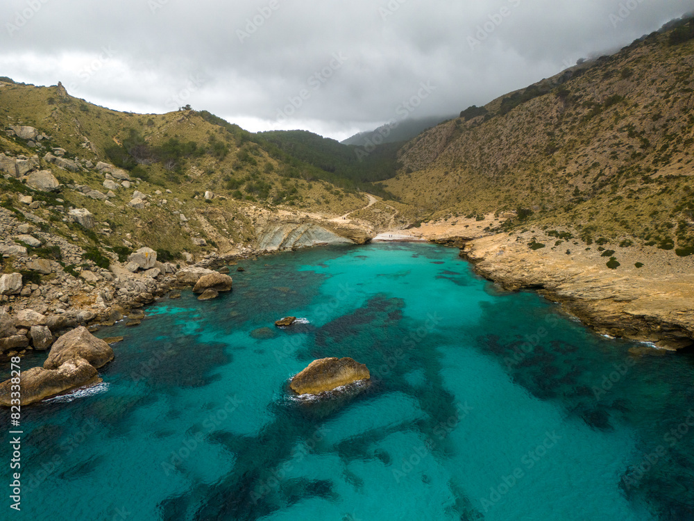 Aerial view of the majestic mountains and turquoise waters. Cala Boquer beach, Mallorca Aerial view of the majestic mountains and turquoise waters. Cala Boquer beach, Mallorca