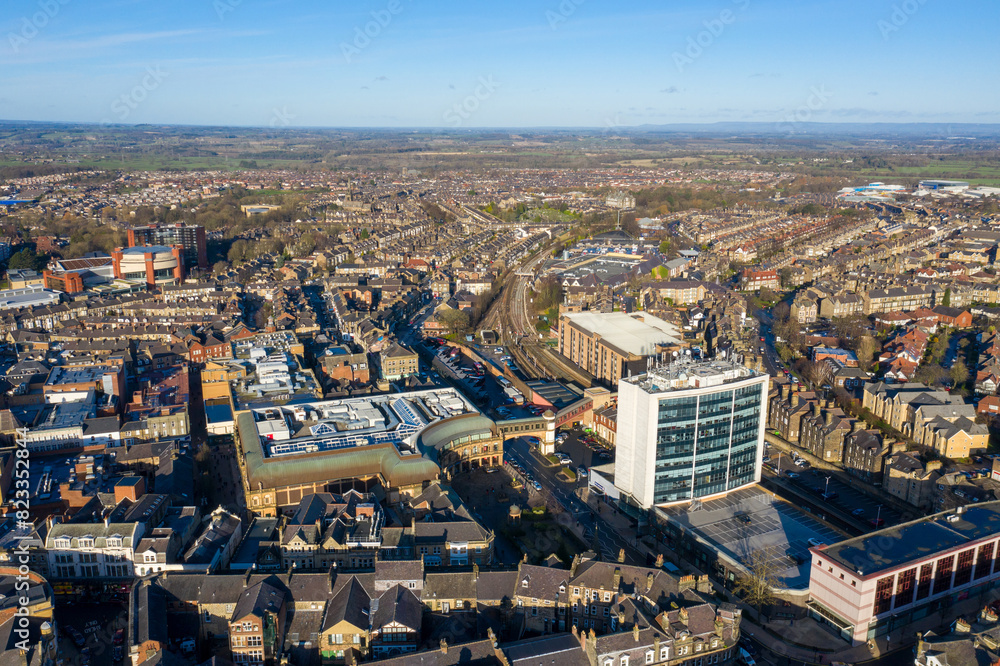 Aerial photo of the town centre of Harrogate North Yorkshire in the UK, showing a drone view of the whole of the town centre in the winter time on a sunny day