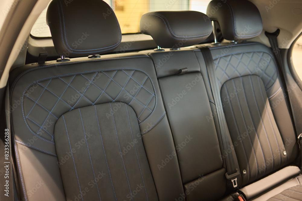 Obraz premium Car back seat with headrest and arm rest, a comfortable automotive fixture