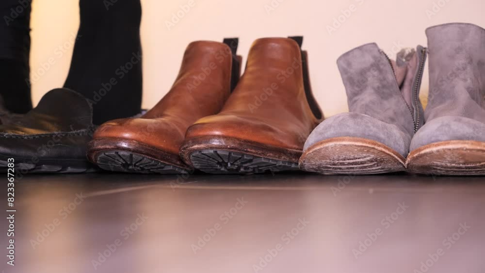 Slow-motion on a male feet wearing black socks and replacing his shoes Slow-motion on a male feet wearing black socks and replacing his shoes