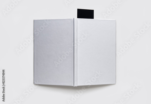 Blank book with a black bookmark on a white background