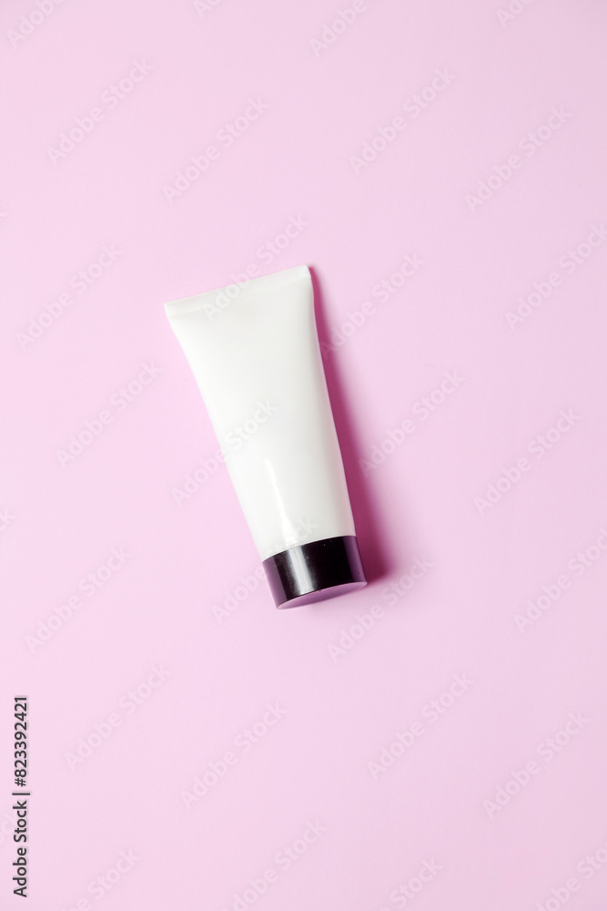 White sunscreen bottle on pink background. Product concept. Sunscreen concept. copy space. White sunscreen bottle on pink background. Product concept. Sunscreen concept. copy space.