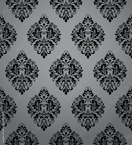 Wallpaper in the style of Baroque. Seamless vector background. Gray and black floral ornament. Graphic pattern for fabric, wallpaper, packaging. Ornate Damask flower ornament