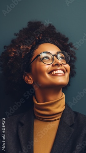 A woman wearing glasses and a turtle neck sweater