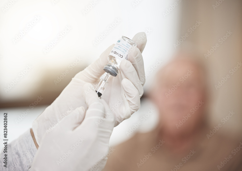Hands, syringe and vial with gloves for vaccine, care or flu medicine in retirement home living room. Closeup, doctor and injection for health, wellness or virus with healthcare life extension drugs Hands, syringe and vial with gloves for vaccine, care or flu medicine in retirement home living room. Closeup, doctor and injection for health, wellness or virus with healthcare life extension drugs