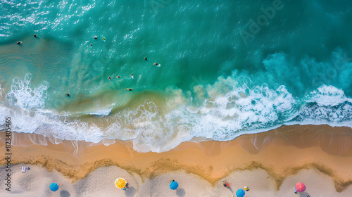 Aerial view of beach with swimmers and colorful umbrellas © ALEXSTUDIO