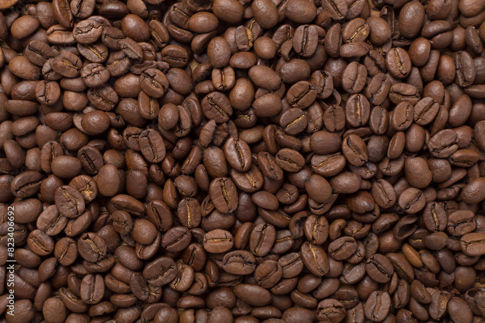 Roasted coffee beans as background, top view Roasted coffee beans as background, top view