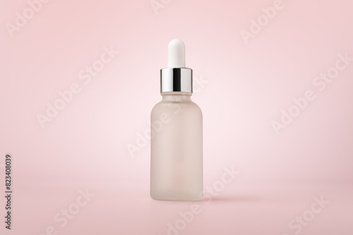 White glass dropper serum bottle