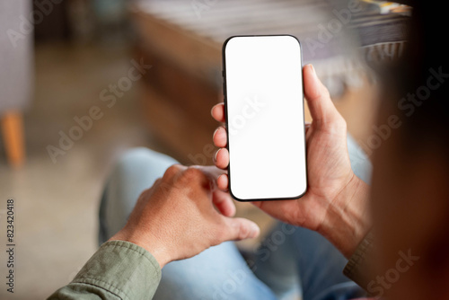 cell phone blank white screen mockup.hand holding texting using mobile on desk at office.background empty space for advertise.work people contact marketing business,technology